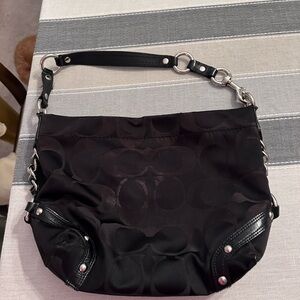 Signature COACH shoulder bag.